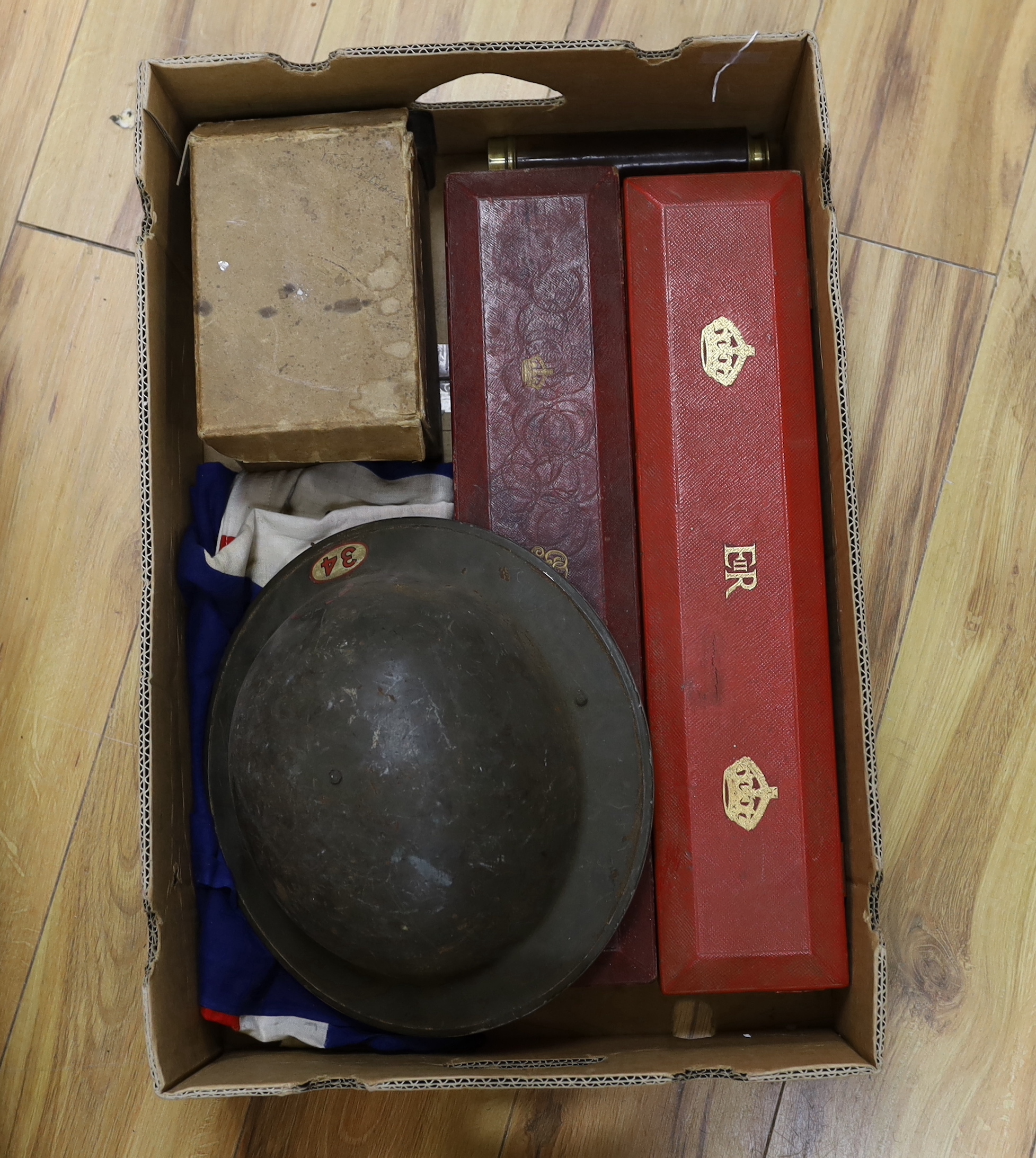 A collection of militaria, including; a pair of First World War military leather boots with wooden boot stretchers, two scroll boxes with Royal Cyphers for George V and Elizabeth II, a four draw telescope, a large union